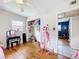Bedroom featuring hardwood flooring, neutral walls, a peek to another bedroom and a closet at 515 Scenic St, Leesburg, FL 34748