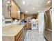 Functional kitchen featuring ample counter space, cabinetry and stainless steel appliances at 515 Scenic St, Leesburg, FL 34748