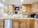 Well-equipped kitchen boasting abundant cabinetry and stainless steel dishwasher at 515 Scenic St, Leesburg, FL 34748