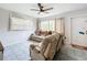 Well-lit living room with tile floors, comfortable sofas, and large windows at 515 Scenic St, Leesburg, FL 34748