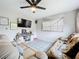 Cozy living room with tile floors, ceiling fan and comfortable seating at 515 Scenic St, Leesburg, FL 34748