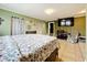 Generously sized main bedroom with tile flooring, fireplace, and TV at 515 Scenic St, Leesburg, FL 34748