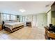 Spacious main bedroom with fireplace, tile flooring, and ample natural light at 515 Scenic St, Leesburg, FL 34748
