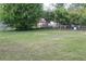 Large backyard featuring grassy area with privacy provided by perimeter trees at 5177 Edwina St, Orlando, FL 32811