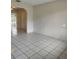 Spacious living room featuring tile flooring, archways, and a view of the backyard at 5177 Edwina St, Orlando, FL 32811
