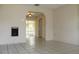 Open-concept living area with tile flooring, archways, and sliding glass door to the back, creating a welcoming atmosphere at 5177 Edwina St, Orlando, FL 32811