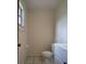 Small toilet room features a toilet, toilet paper holder, and towel bar at 5177 Edwina St, Orlando, FL 32811
