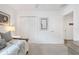 Bright room features white walls, plush carpeting, and closet for ample storage at 5726 Leboeuf Ln, The Villages, FL 32163