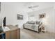Cozy bedroom with daybed, desk, ceiling fan, carpet flooring, and neutral decor at 5726 Leboeuf Ln, The Villages, FL 32163