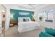 Inviting main bedroom with accent wall, tray ceiling, and large window for lots of natural light at 5726 Leboeuf Ln, The Villages, FL 32163