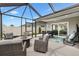 Covered patio features ample seating, dining area, and backyard views at 5726 Leboeuf Ln, The Villages, FL 32163