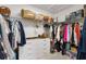 Spacious walk-in closet provides ample storage with custom shelving and organization at 5726 Leboeuf Ln, The Villages, FL 32163