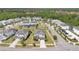 Aerial view of a suburban neighborhood featuring well-manicured lawns and community streets at 598 Marcello Blvd, Kissimmee, FL 34746