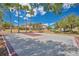 Community basketball court with well-maintained surface, basketball hoops, and surrounding landscaping at 598 Marcello Blvd, Kissimmee, FL 34746