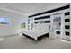 Spacious bedroom with bright, natural light and unique horizontal striped design at 598 Marcello Blvd, Kissimmee, FL 34746