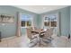 Elegant dining room features lots of natural light, neutral paint color and modern furnishings at 598 Marcello Blvd, Kissimmee, FL 34746