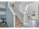 Inviting two-story foyer featuring neutral colors, tile flooring, and natural light at 598 Marcello Blvd, Kissimmee, FL 34746