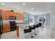 Bright kitchen with granite countertops, wood cabinets, and a breakfast bar perfect for entertaining at 598 Marcello Blvd, Kissimmee, FL 34746