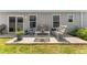 Peaceful patio area with outdoor seating and manicured greenery at 6342 Whittle Ct, The Villages, FL 32163