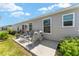 Inviting back patio with seating area, perfect for relaxing outdoors at 6342 Whittle Ct, The Villages, FL 32163