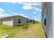 A view of the backyard, showcasing the green space between homes in the community at 6342 Whittle Ct, The Villages, FL 32163