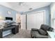 Bedroom with blue walls, carpet, walk-in closet and natural light at 6342 Whittle Ct, The Villages, FL 32163