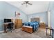 Bright bedroom features vaulted ceiling, ceiling fan, natural light and beautiful wood furniture at 6342 Whittle Ct, The Villages, FL 32163