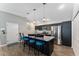 Kitchen with island seating, stainless steel appliances, and lots of storage at 6342 Whittle Ct, The Villages, FL 32163