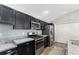 Modern kitchen with stainless steel appliances, granite countertops and ample storage at 6342 Whittle Ct, The Villages, FL 32163