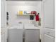 Convenient laundry room equipped with a washer and dryer at 6342 Whittle Ct, The Villages, FL 32163