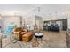 Open-concept living space featuring wood floors and views into the kitchen and dining area at 6342 Whittle Ct, The Villages, FL 32163