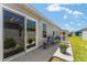 Cozy back patio perfect for outdoor seating and enjoying the serene surroundings at 6342 Whittle Ct, The Villages, FL 32163