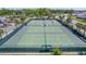 Aerial view of the well-maintained community tennis courts, ready for a match at 6342 Whittle Ct, The Villages, FL 32163