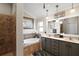 This bathroom offers double sinks, soaking tub, and separate tiled shower for spa-like experience at 685 Winifred Way, The Villages, FL 32162