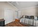 This bedroom has a bed, closet with ample space, and modern flooring for a cozy space at 685 Winifred Way, The Villages, FL 32162
