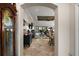 View through the foyer showing a spacious living room and dining area at 685 Winifred Way, The Villages, FL 32162