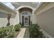 Inviting front entrance with well-maintained landscaping and a welcoming door at 685 Winifred Way, The Villages, FL 32162