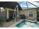 Outdoor hot tub area with grill, umbrella, and patio space for relaxing and entertaining at 685 Winifred Way, The Villages, FL 32162