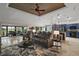 Spacious living room with comfortable seating, a ceiling fan, and an open layout at 685 Winifred Way, The Villages, FL 32162