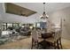 Open-concept living space combining dining, living, and kitchen areas at 685 Winifred Way, The Villages, FL 32162