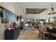 Open concept living room with access to the dining and kitchen areas at 685 Winifred Way, The Villages, FL 32162