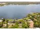 Aerial view of the property and its proximity to the lake, highlighting the waterfront community at 7115 Lake Ola Dr, Mount Dora, FL 32757
