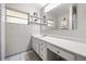 Bright bathroom featuring ample counter space, vanity, and a large mirror at 7115 Lake Ola Dr, Mount Dora, FL 32757
