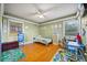 Spacious bedroom with hardwood floors and plenty of room for play and relaxation at 7115 Lake Ola Dr, Mount Dora, FL 32757