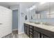 Modern bathroom featuring a double sink vanity, tile floors, and separate shower area at 814 Olive Ave, Fruitland Park, FL 34731