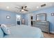 Comfortable bedroom features an ensuite bathroom, dresser, and stylish decor at 814 Olive Ave, Fruitland Park, FL 34731