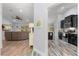 Open concept living space with hardwood floors leading to a modern kitchen at 814 Olive Ave, Fruitland Park, FL 34731