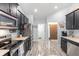 Modern kitchen with stainless steel appliances and access to the entryway and other rooms at 814 Olive Ave, Fruitland Park, FL 34731