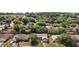 Charming homes nestled among mature trees in a peaceful neighborhood setting from an aerial view at 831 Whisper Sound, Minneola, FL 34715