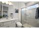 This is a modern bathroom featuring a glass-enclosed shower, a vanity with a sink, and contemporary decor at 8433 Sw 98Th Terrace Rd, Ocala, FL 34481